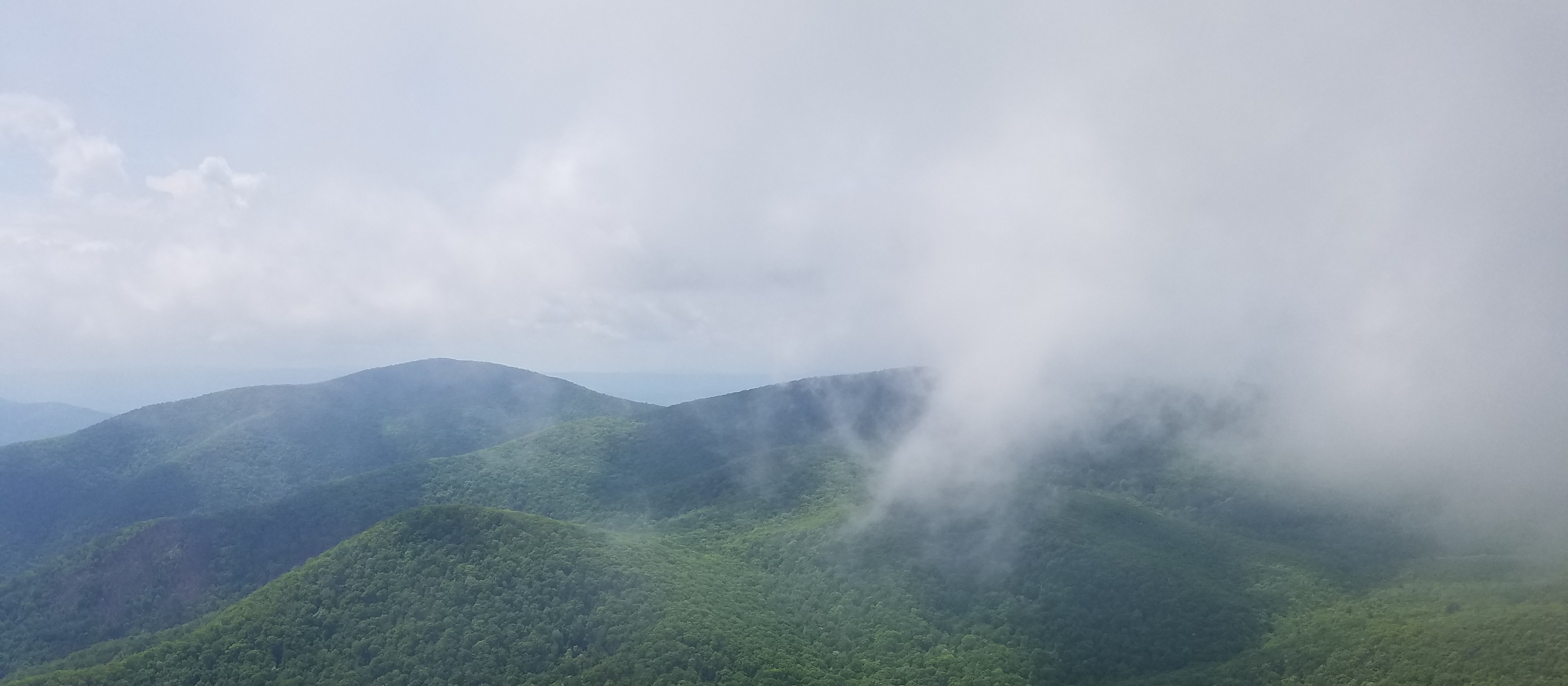blue ridge mountains and fog encroaching
